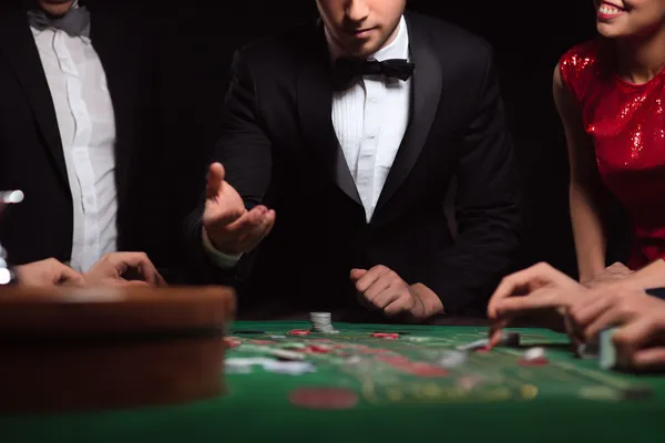 A glowing roulette wheel with cascading chips, symbolizing the engaging live and instant-win games available on CHEZABET.